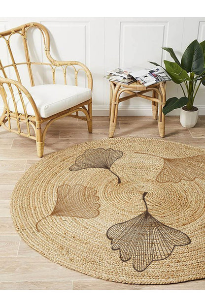 Boho 907 Floral Desenli Örgü Yuvarlak Natural Çift Taraflı Halı, doğal jüt ipliğiyle üretilmiş, çift taraflı kullanılabilen ve modern bir tasarıma sahip.